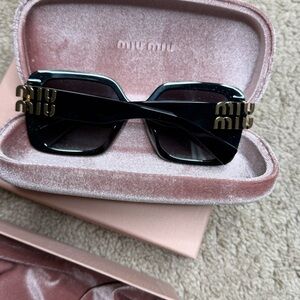 Miu Miu Black and Gold Sunglasses